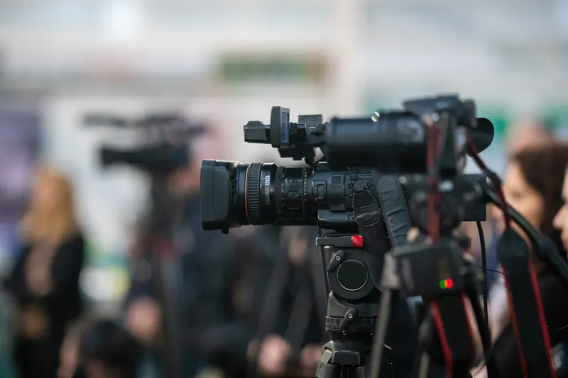 Press cameras lined up at a premiere