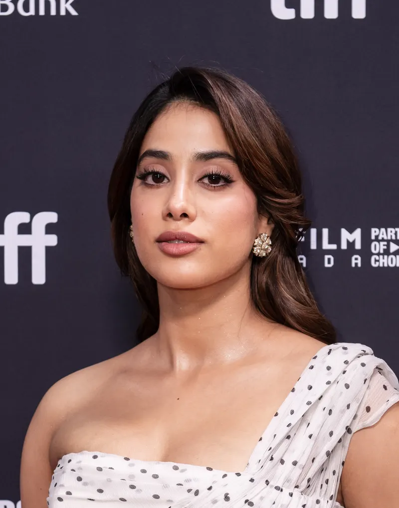 Janhvi Kapoor in a white polka dot dress on a festival red carpet
