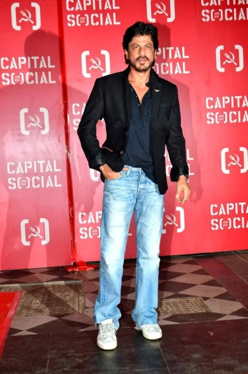 Shah Rukh Khan in a black blazer and jeans
