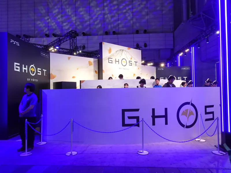 Ghost of Yōtei branded demo booth lit in purple at Tokyo Game Show