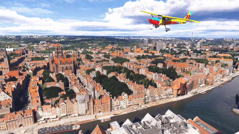 A light aircraft flying over a historic Polish city in Microsoft Flight Simulator 2024