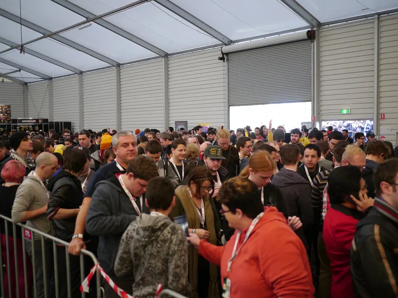 Fans waiting in a long queue inside a marquee at PAX Australia