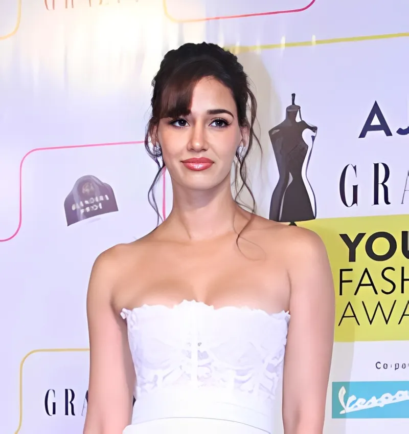 Disha Patani in a white strapless outfit at a fashion awards event