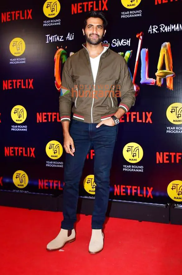 Akshay Oberoi in a bomber jacket on a red carpet