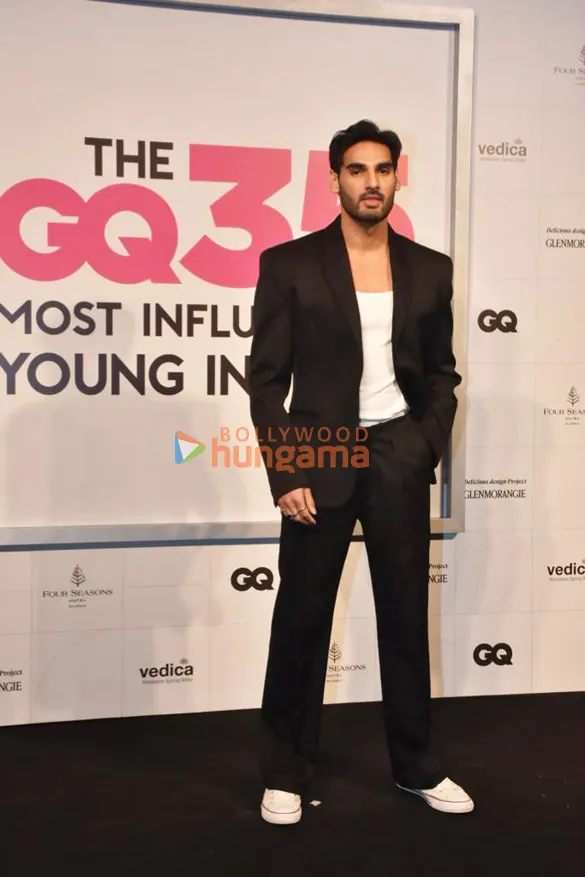 Ahan Shetty in a black suit at a media event