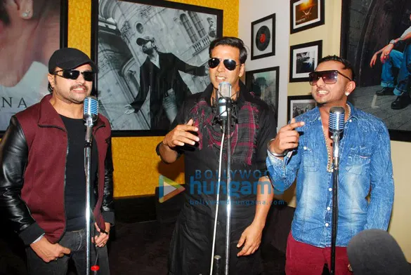 Himesh Reshammiya, Akshay Kumar and Yo Yo Honey Singh at studio microphones