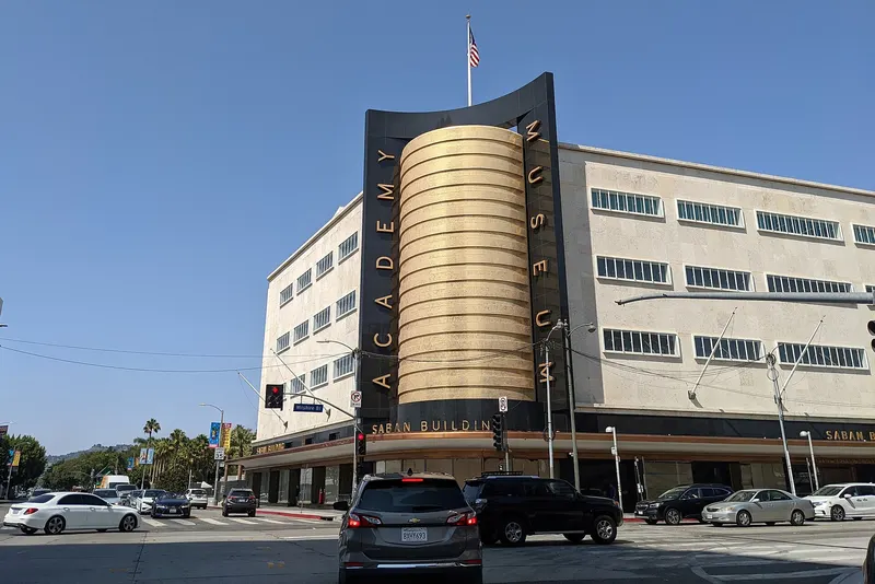 The gold cylindrical Saban Building tower of the Academy Museum on Wilshire Boulevard, Los Angeles