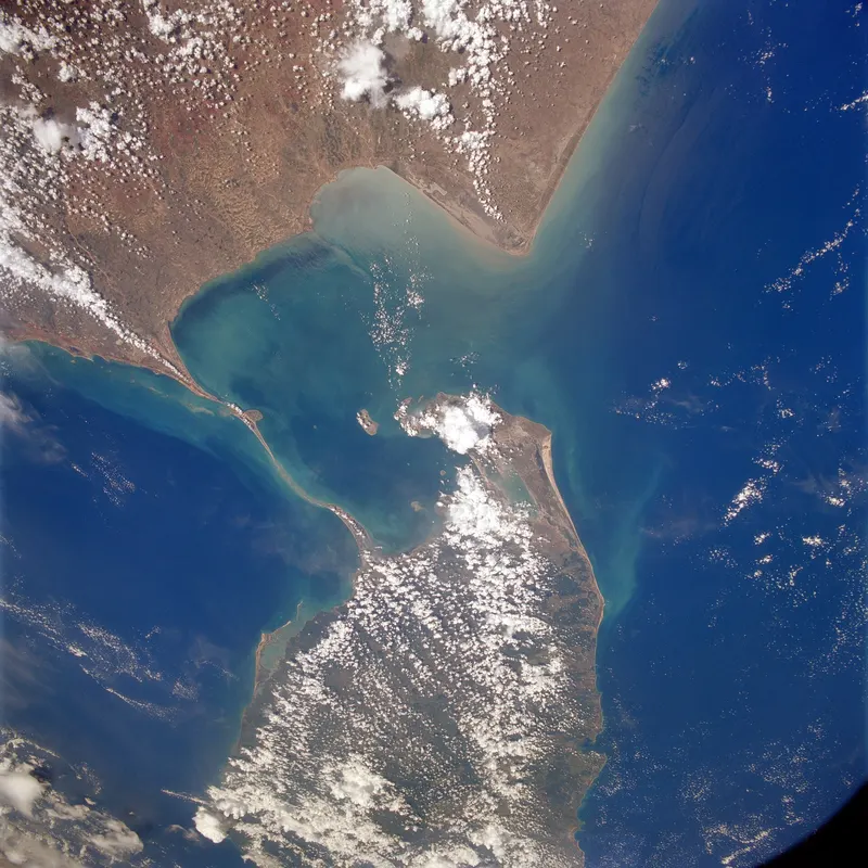 Satellite view of the chain of shoals linking southern India and Sri Lanka across turquoise water
