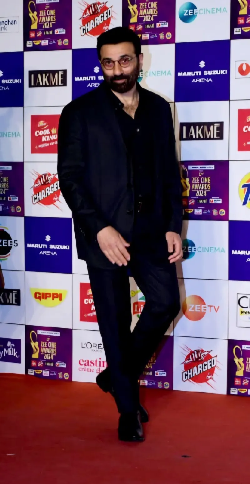 Sunny Deol in a black outfit on a red carpet