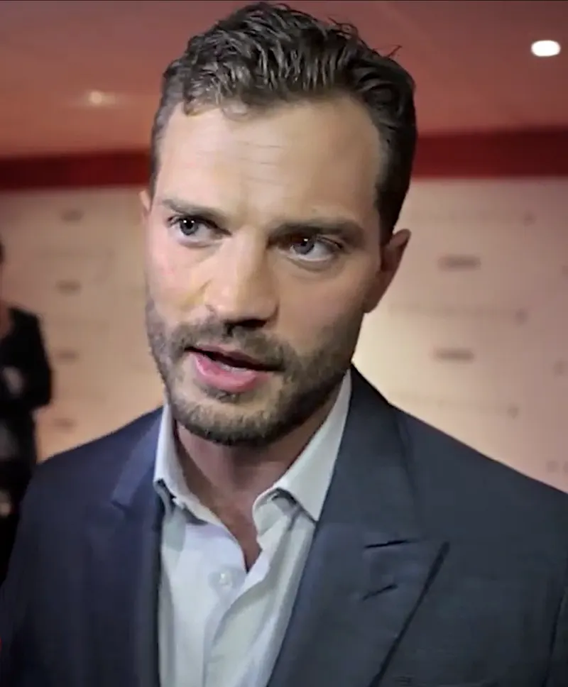 Jamie Dornan speaking to camera at a film festival