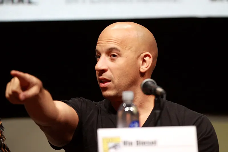 Vin Diesel pointing during a convention panel