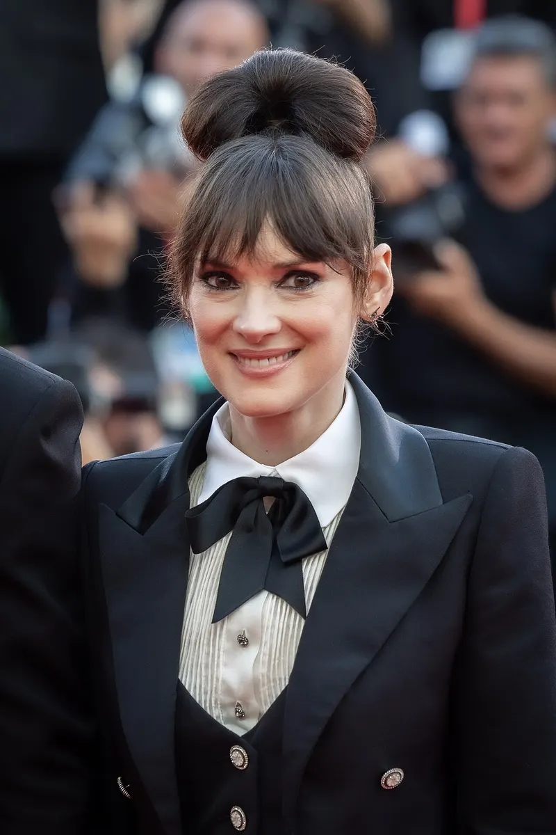 Winona Ryder smiling on a red carpet