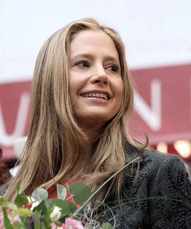 Mira Sorvino smiling at a public event