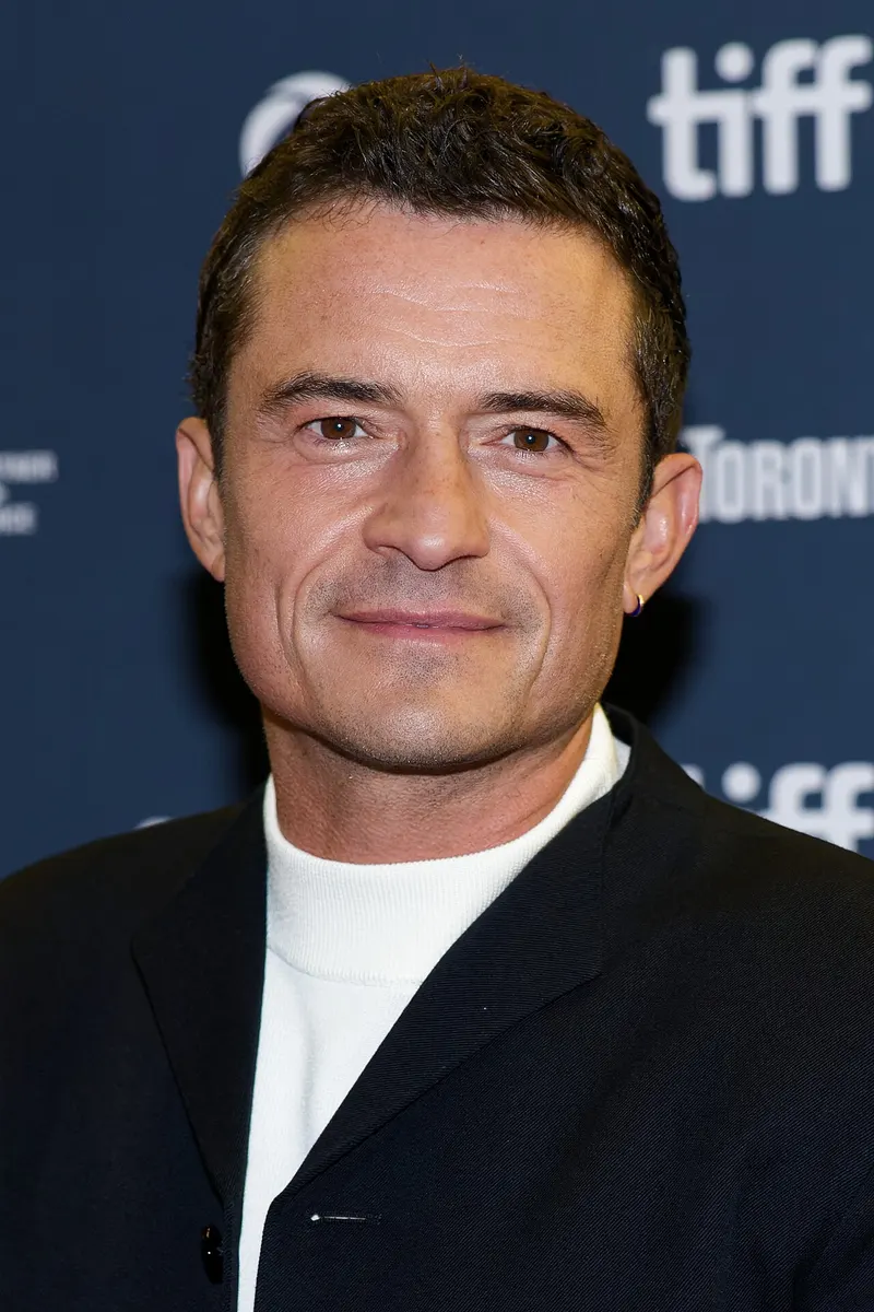 Orlando Bloom in a dark jacket at a film festival