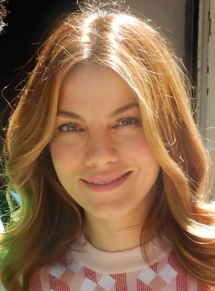 Michelle Monaghan smiling with long auburn hair
