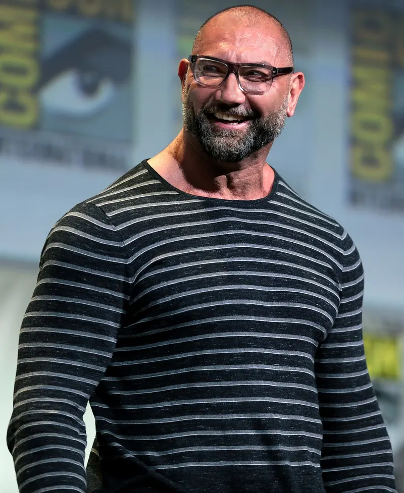 Dave Bautista smiling on stage at Comic-Con
