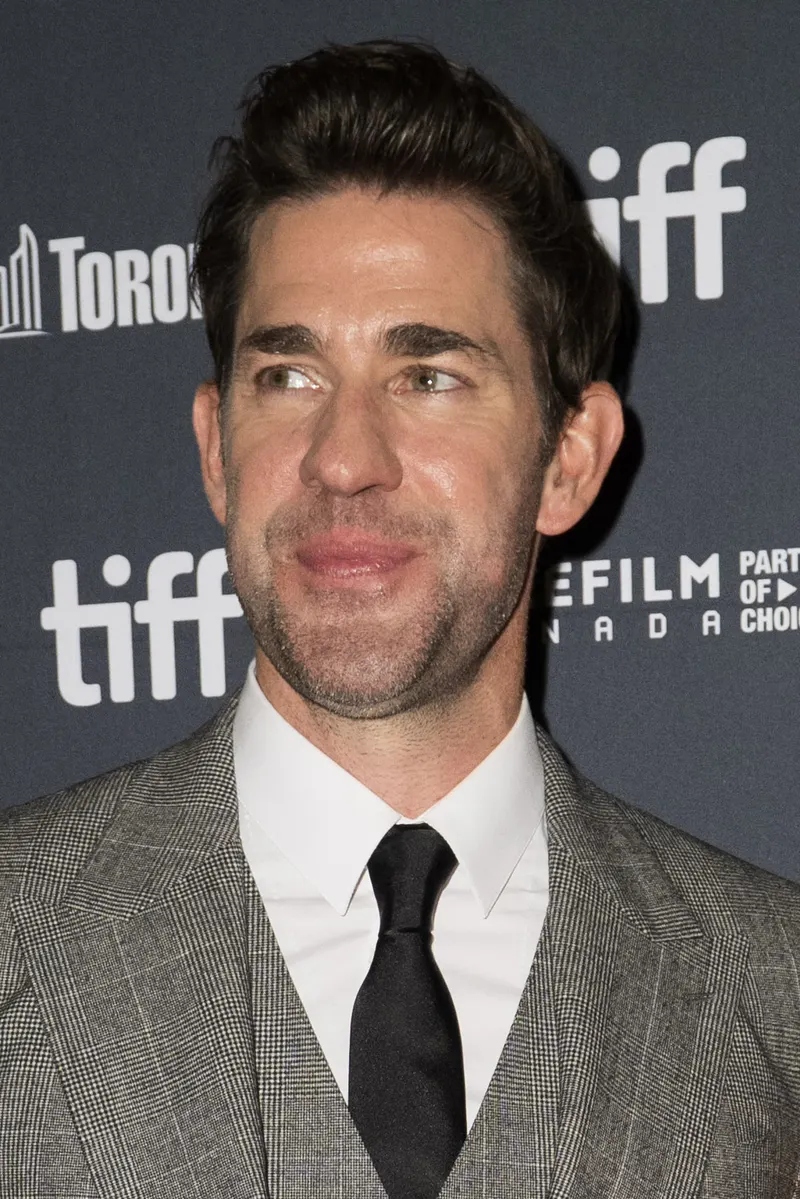 John Krasinski in a suit on a festival red carpet