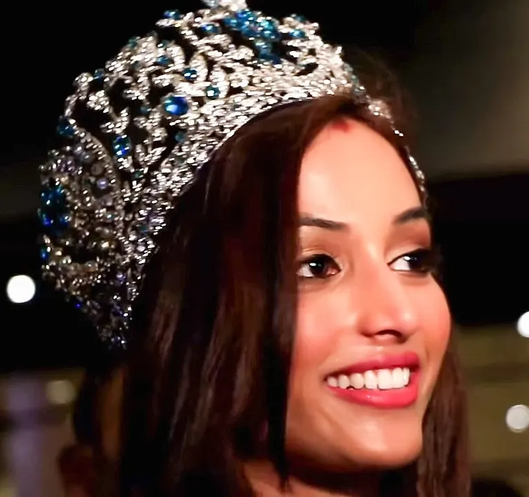 Srinidhi Shetty smiling and wearing a jewelled crown