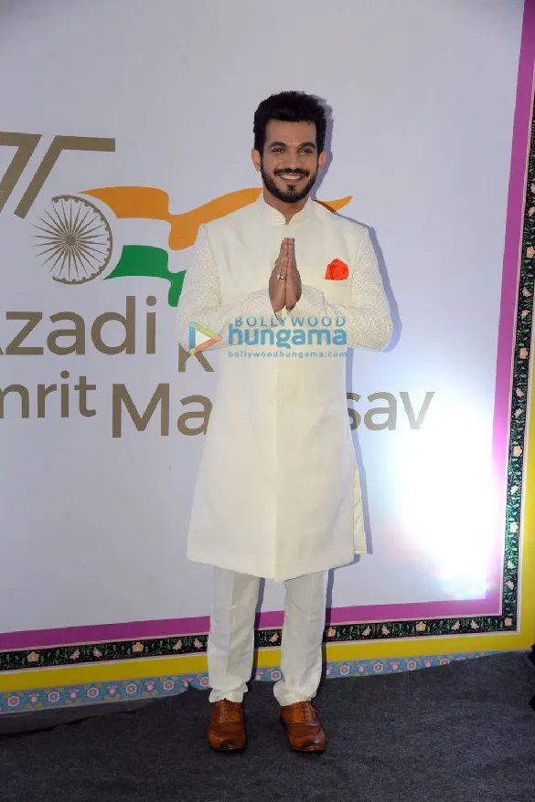 Arjun Bijlani in a white sherwani greeting with folded hands