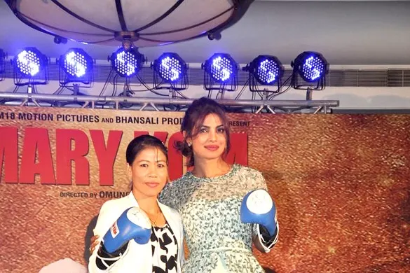 Mary Kom and Priyanka Chopra posing with boxing gloves