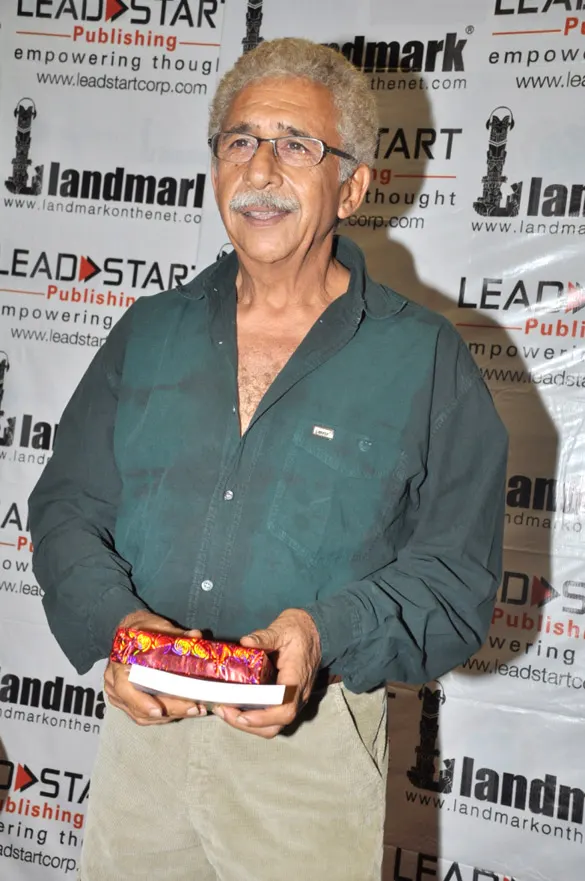 Naseeruddin Shah smiling in a green shirt