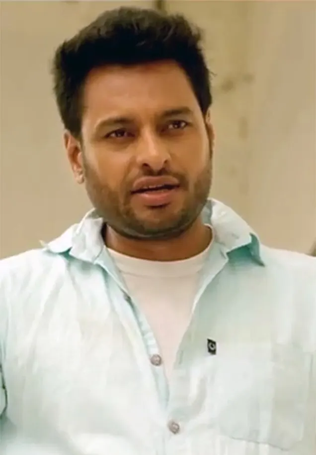 Dev Kharoud in a light blue shirt