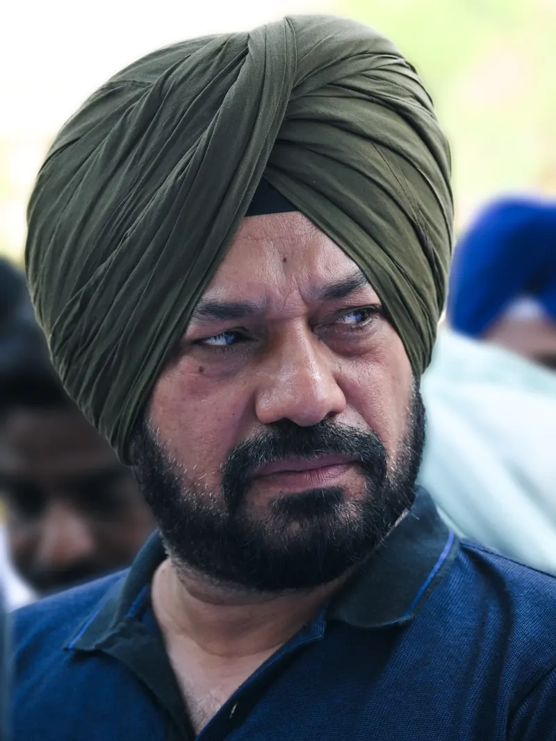 Gurpreet Ghuggi in an olive turban, close-up portrait