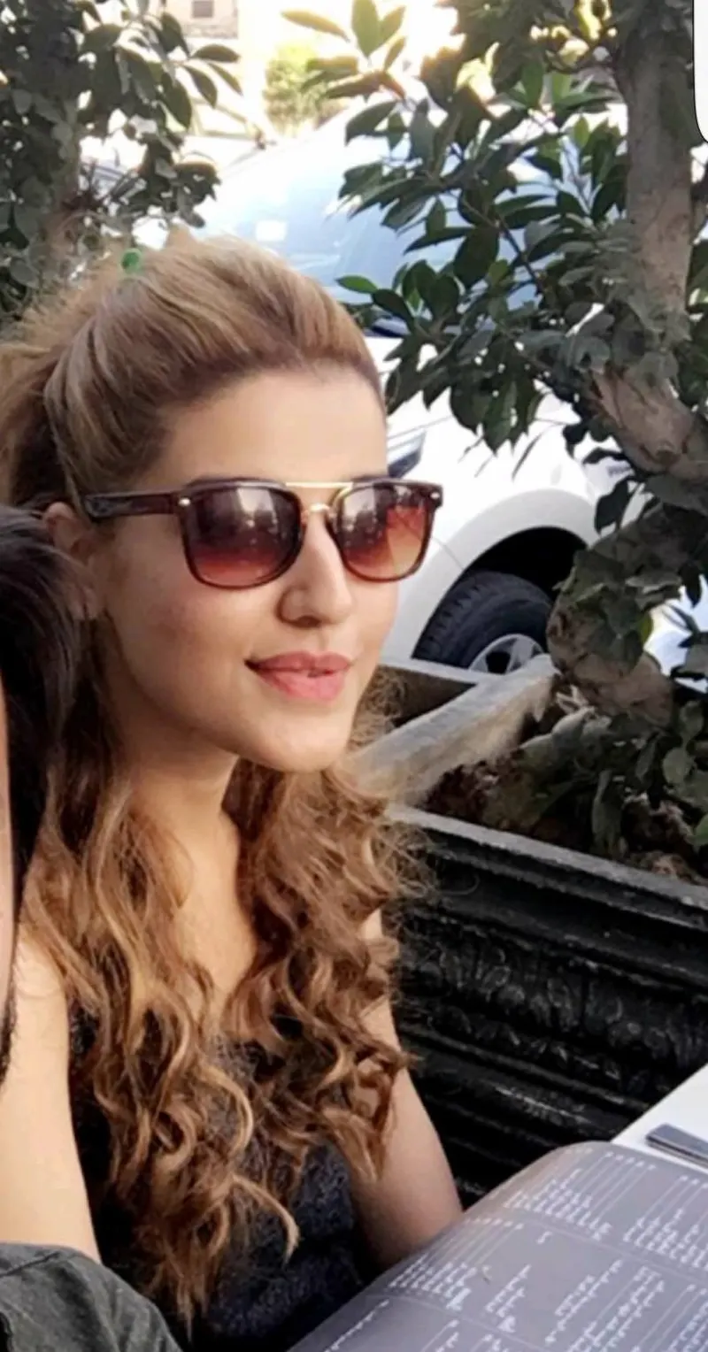 Hareem Farooq in sunglasses outdoors