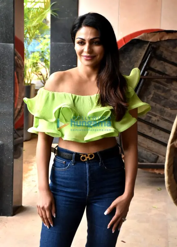 Neeru Bajwa in a green ruffled top and jeans
