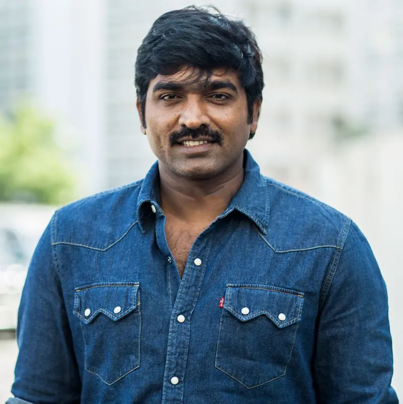 Vijay Sethupathi smiling in a denim shirt
