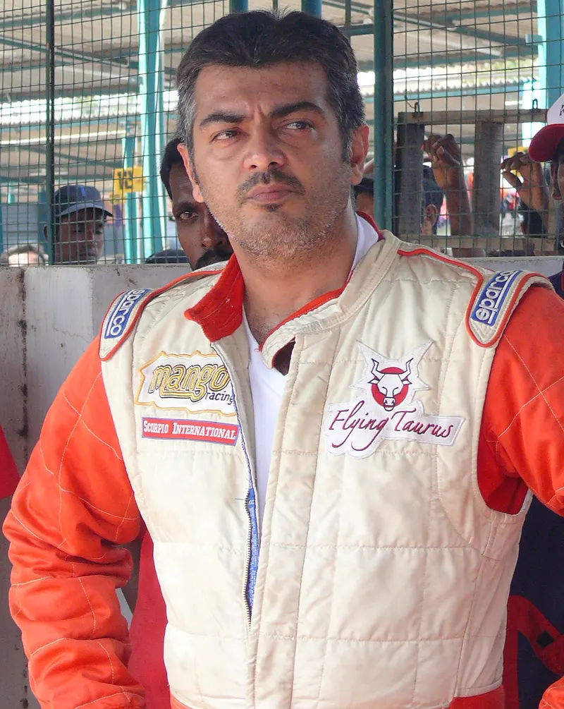 Ajith Kumar in a racing suit in the pit area