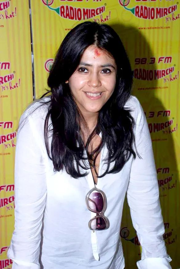 Ektaa Kapoor smiling in a white shirt