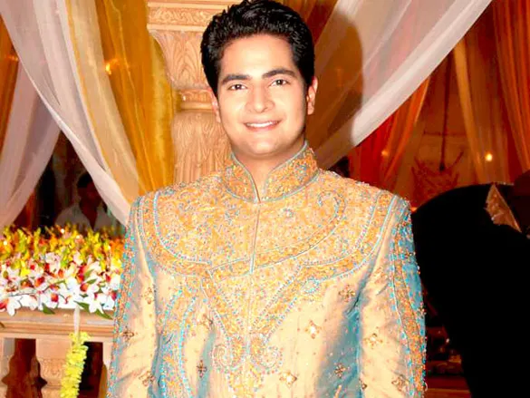 Karan Mehra smiling in an embroidered sherwani