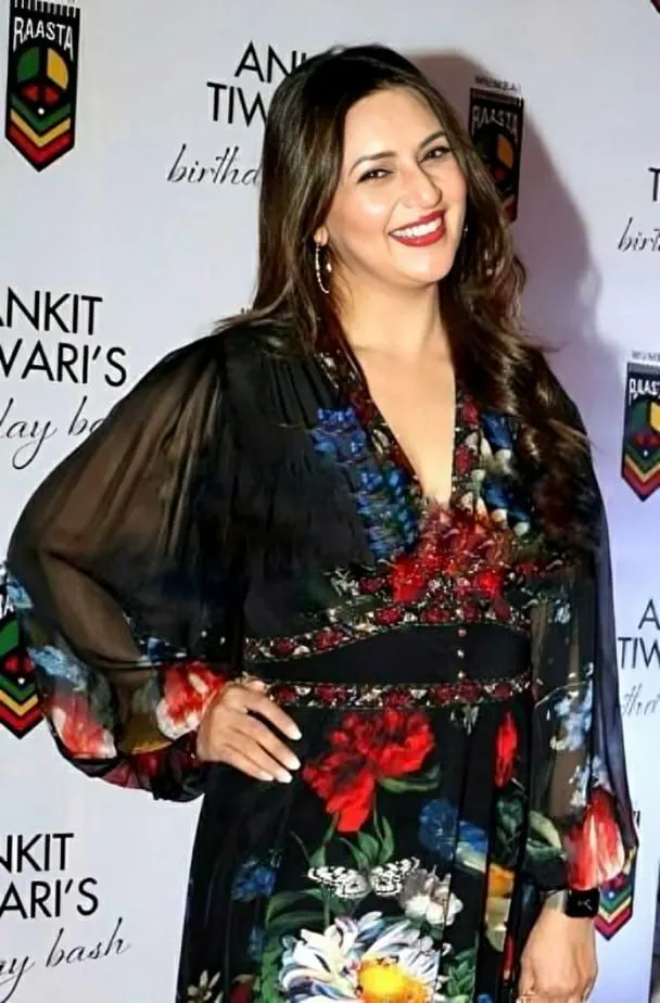 Divyanka Tripathi smiling in a floral dress
