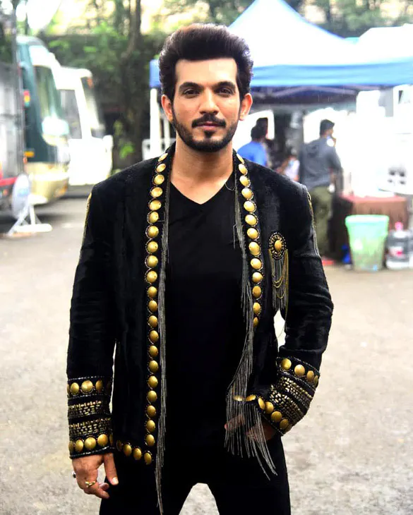 Arjun Bijlani in a black jacket with gold studs
