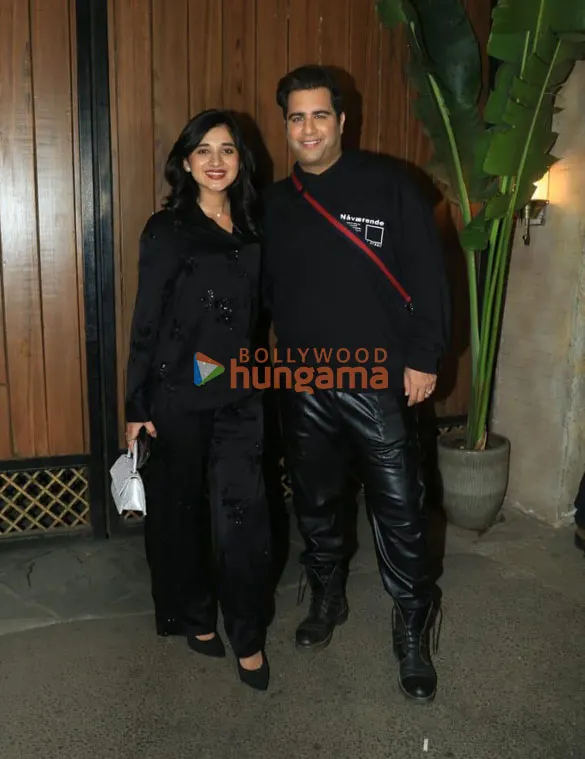 Kanika Mann and Rajiv Adatia posing together dressed in black