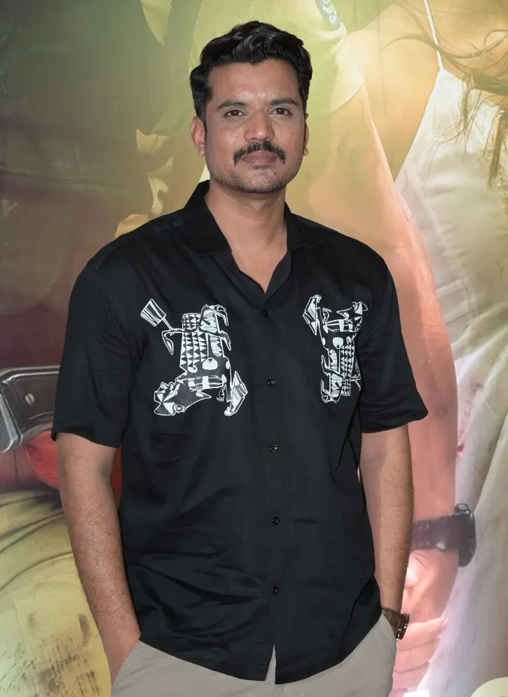 Aasif Khan in a black printed shirt