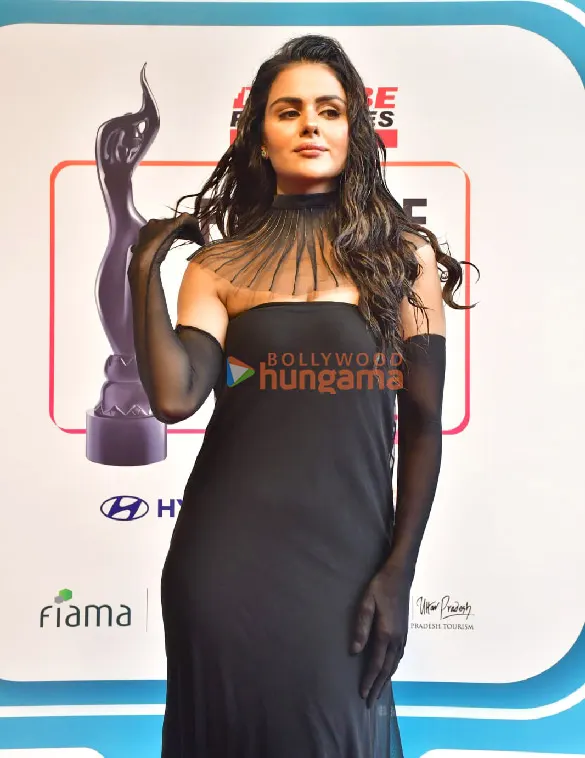 Priyanka Chahar Choudhary in a black gown on a red carpet