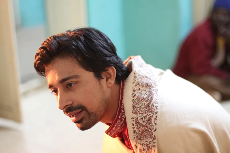 Rannvijay Singha in a cream sherwani looking to one side