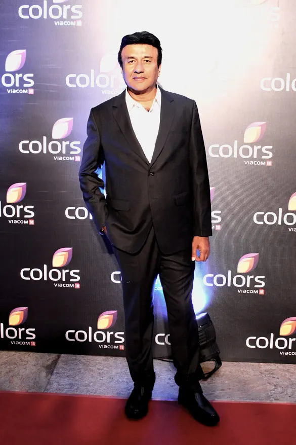 Anu Malik in a dark suit on a red carpet