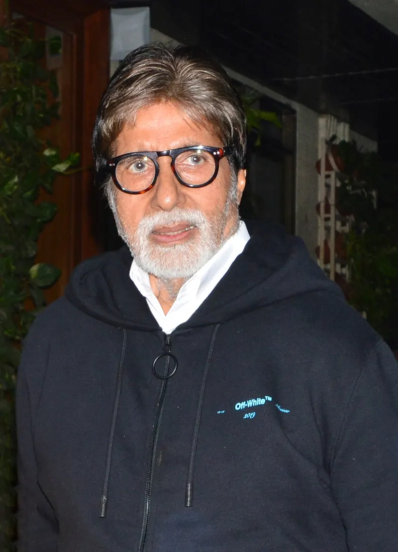 Amitabh Bachchan in glasses and a dark hoodie