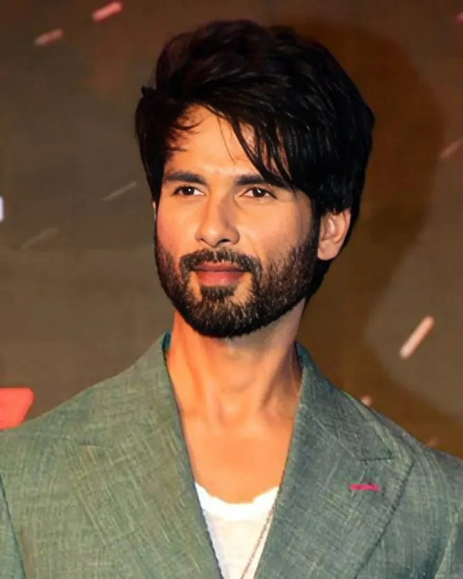 Shahid Kapoor in a green blazer looking at the camera