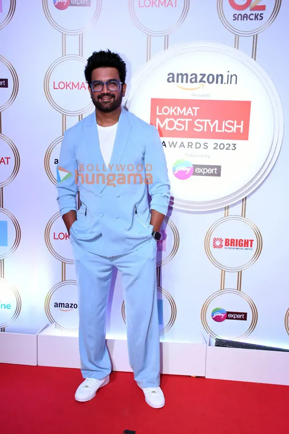 Sharad Kelkar in a pale blue suit on a red carpet