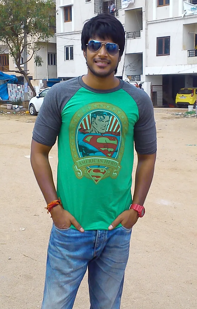 Sundeep Kishan in sunglasses and a green T-shirt
