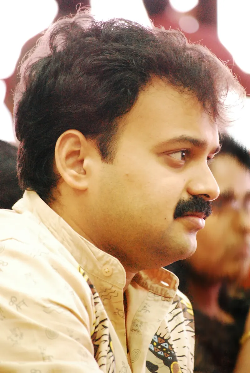 Kunchacko Boban in profile wearing a printed beige shirt