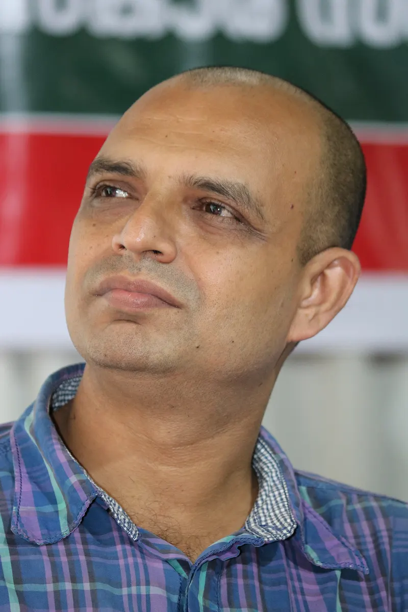 Writer G R Indugopan looking up at a public event