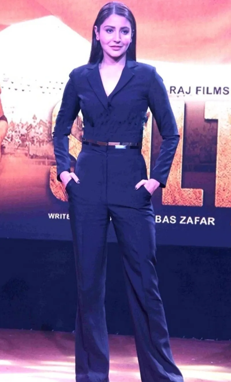 Anushka Sharma in a navy jumpsuit at a film trailer launch